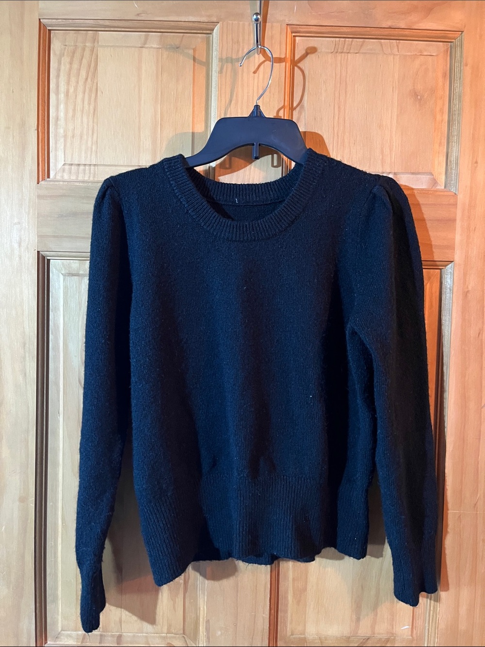 Women’s Black knit sweater with puff shoulder